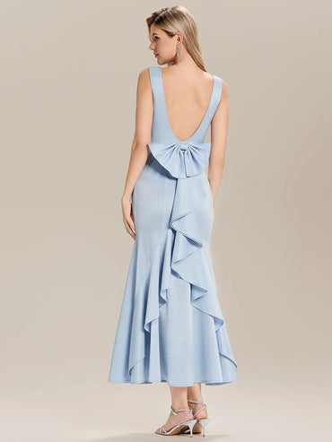 Sleeveless light blue satin mermaid gown with open back and cascading ruffle detail