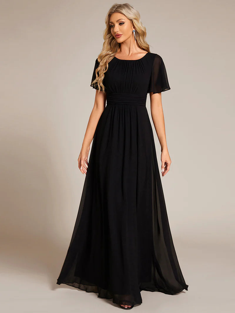 Round neck black bridesmaid gown in a pleated design for elegant wedding looks