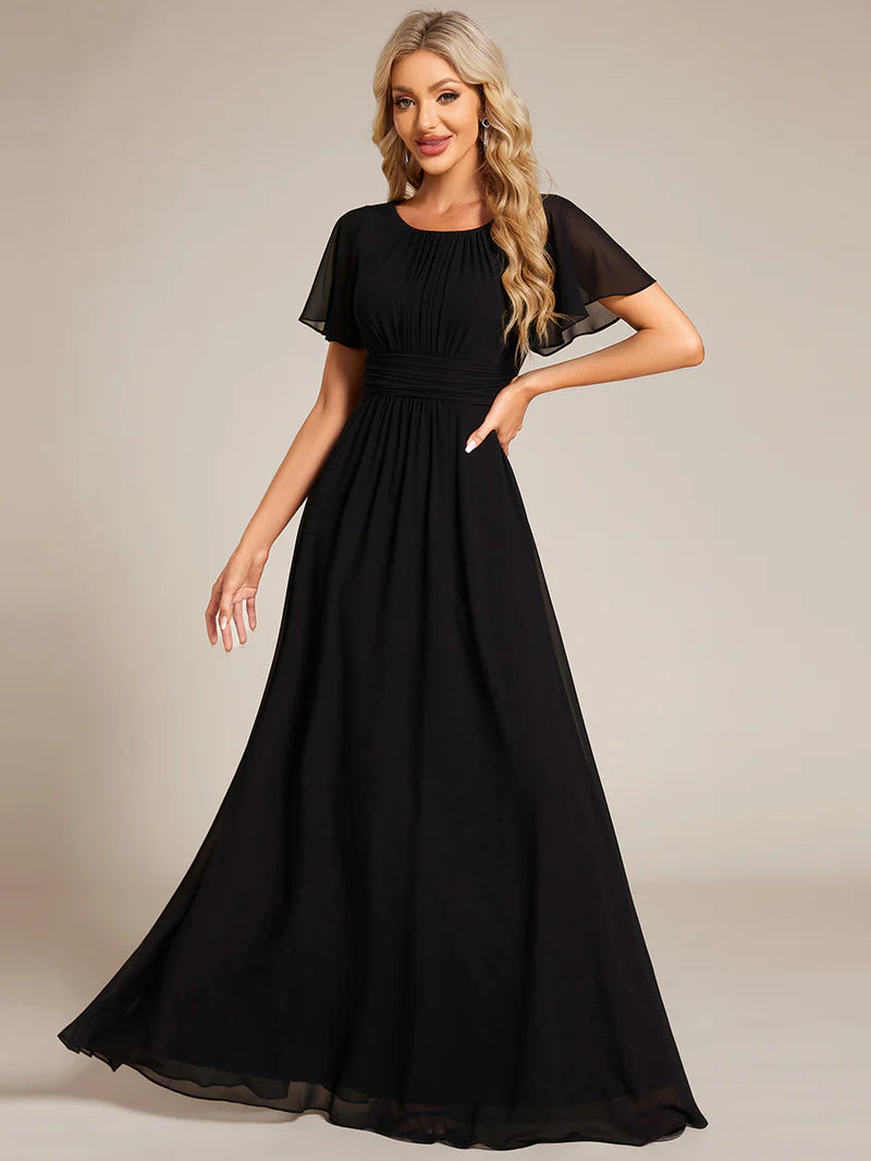 Round neck black bridesmaid gown in a pleated design for elegant wedding looks