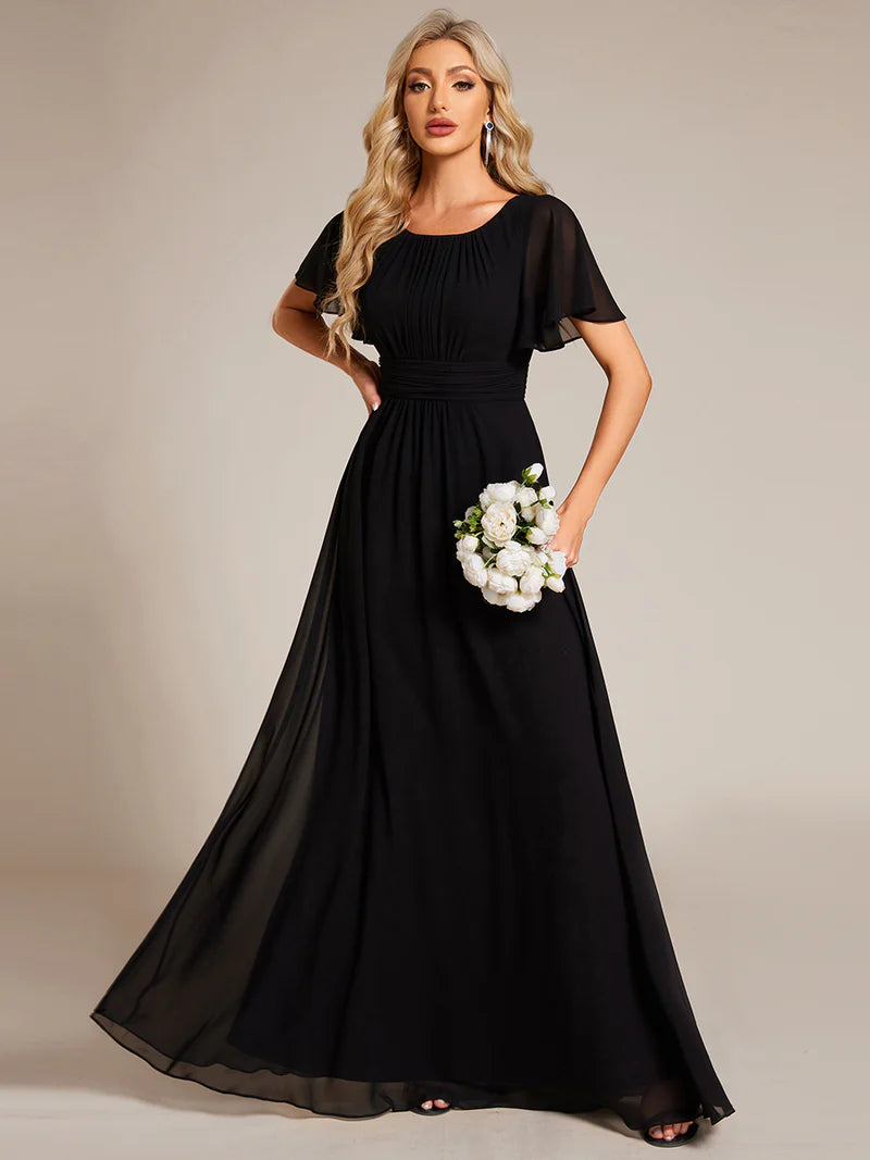 Round neck black ridesmaid gown in a pleated design for elegant wedding looks