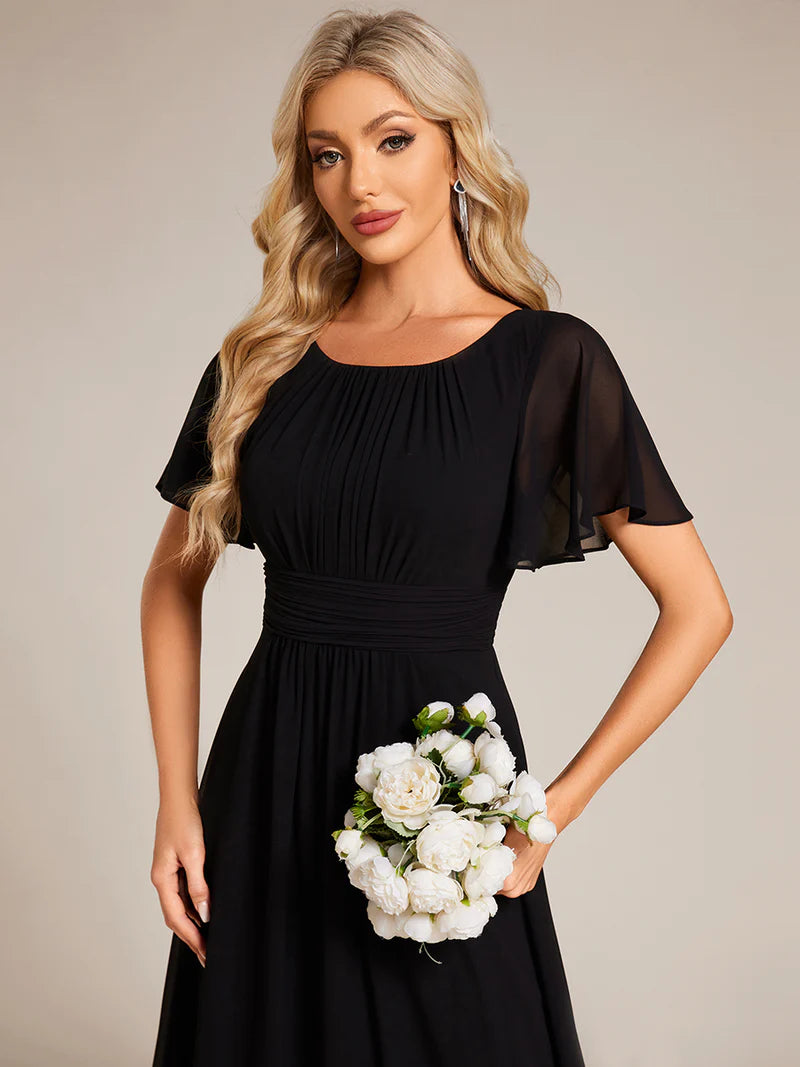Round neck black bridesmaid gown in a pleated design for elegant wedding looks