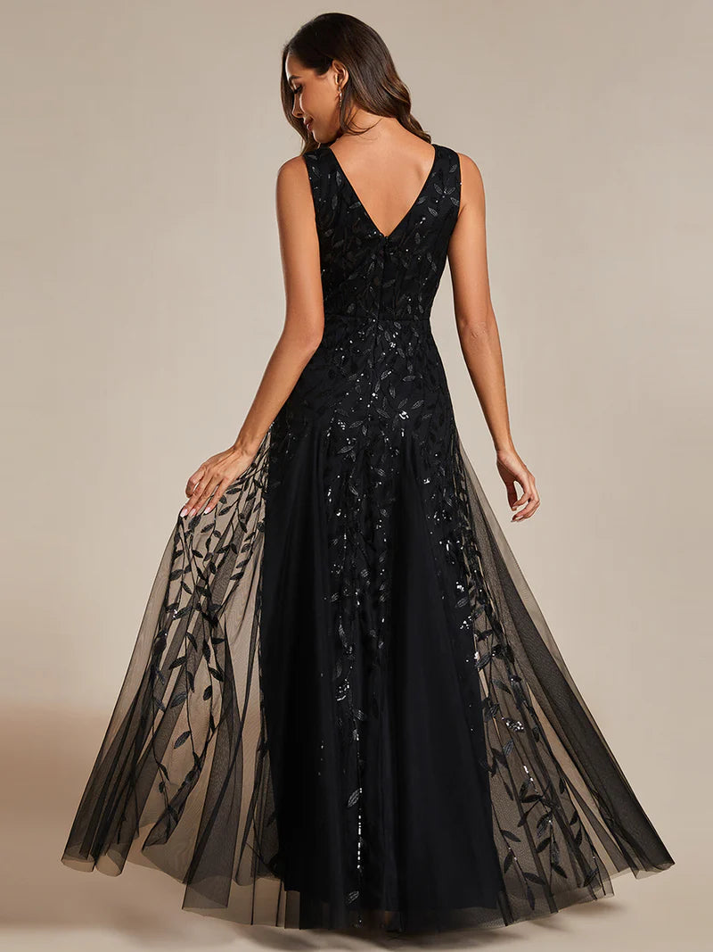 Black sleeveless evening dress with shiny sequins, deep V-neckline, and tulle skirt