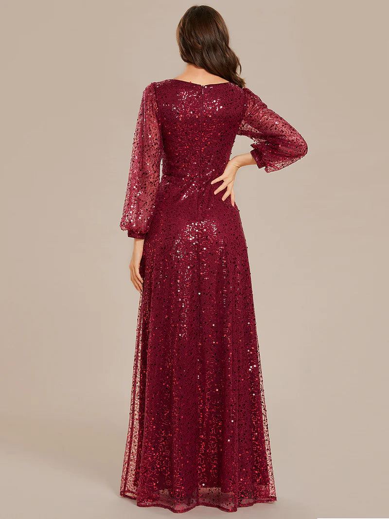 Burgundy chiffon guest dress with V-neckline, long sleeves, and fitted waist