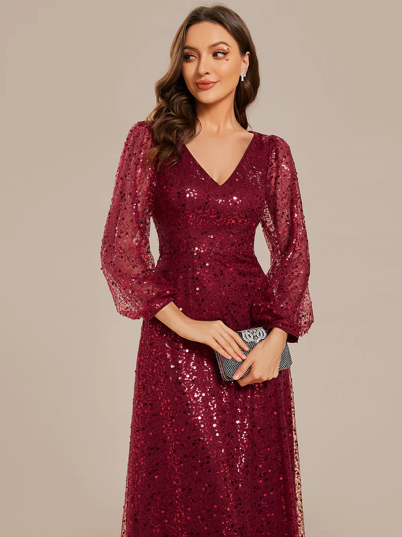 Burgundy chiffon guest dress with V-neckline, long sleeves, and fitted waist