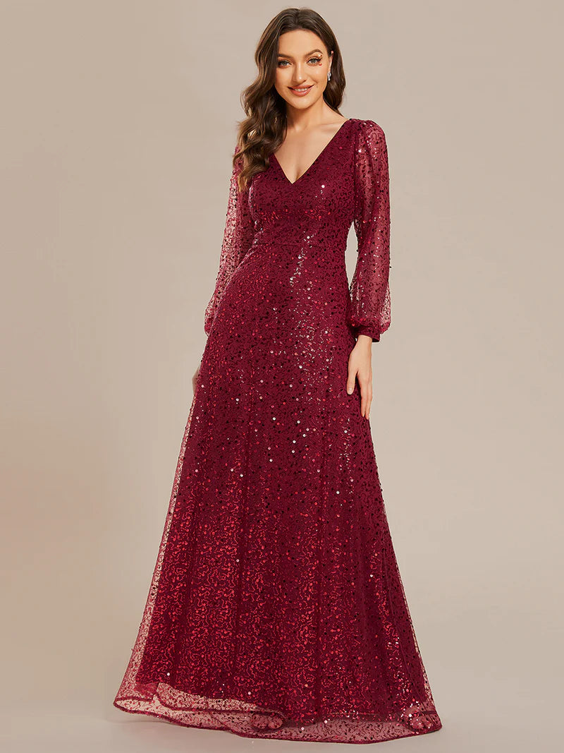 Burgundy chiffon guest dress with V-neckline, long sleeves, and fitted waist
