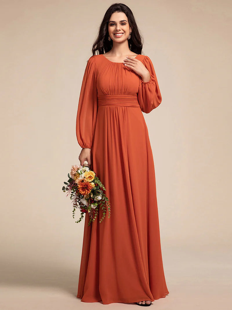 Burnt orange bridesmaid dress with round neckline and long lantern sleeves