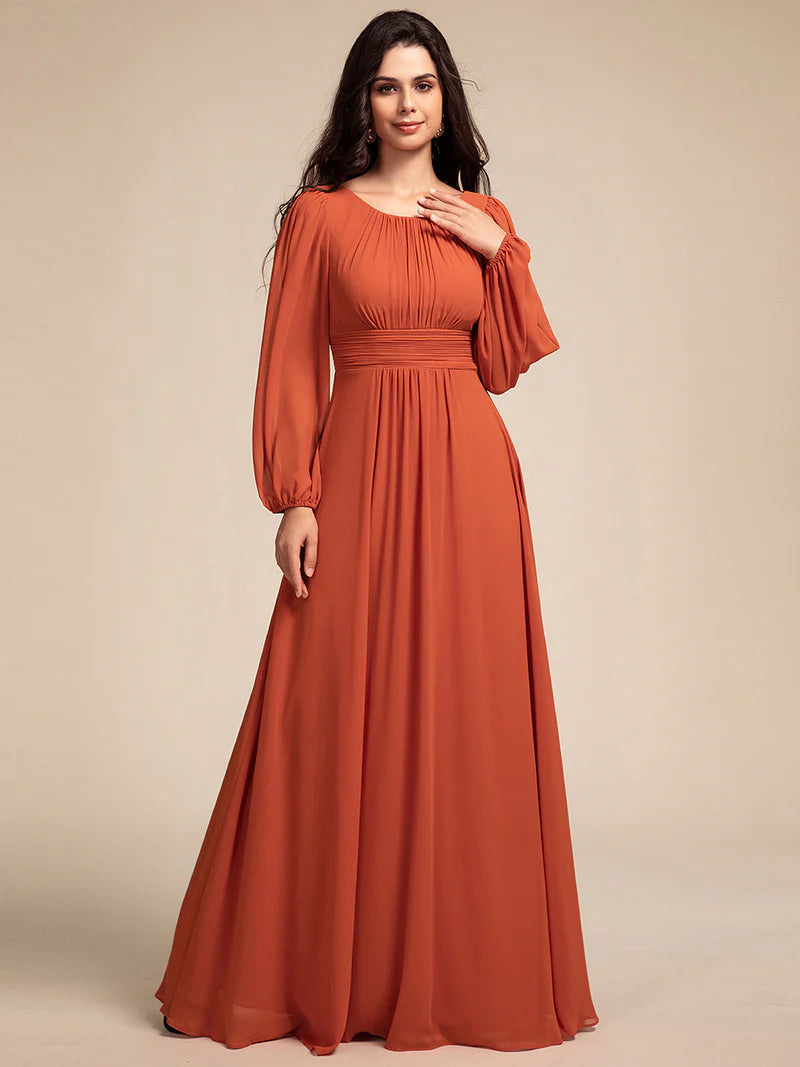 Burnt orange bridesmaid dress with round neckline and long lantern sleeves
