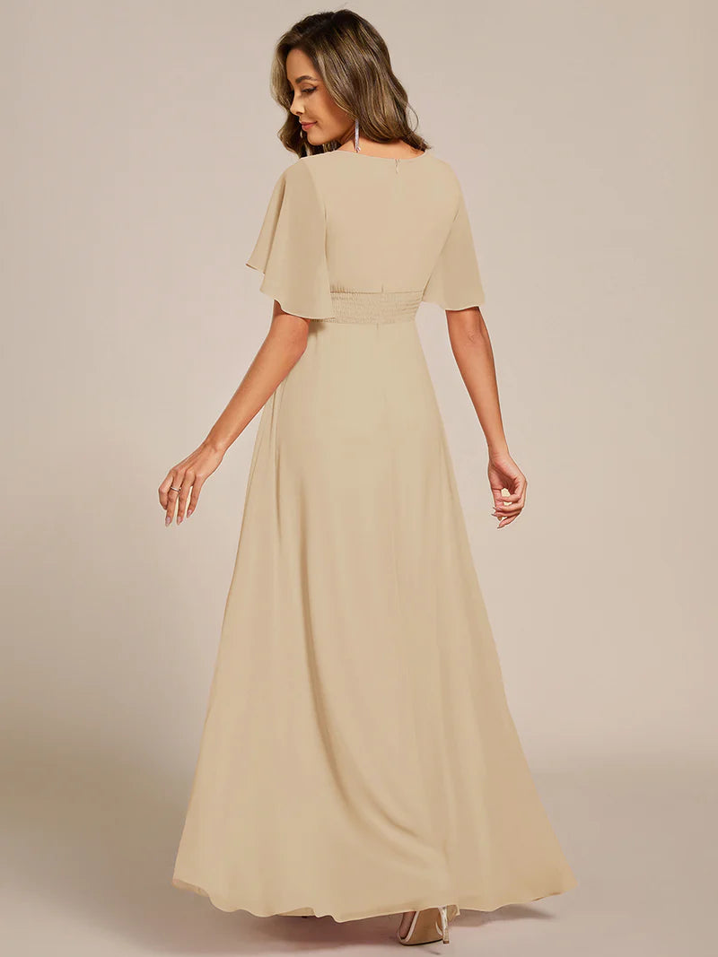 charcoal a-line floor-length evening dress with short sleeves, pleated skirt, and applique embellishments