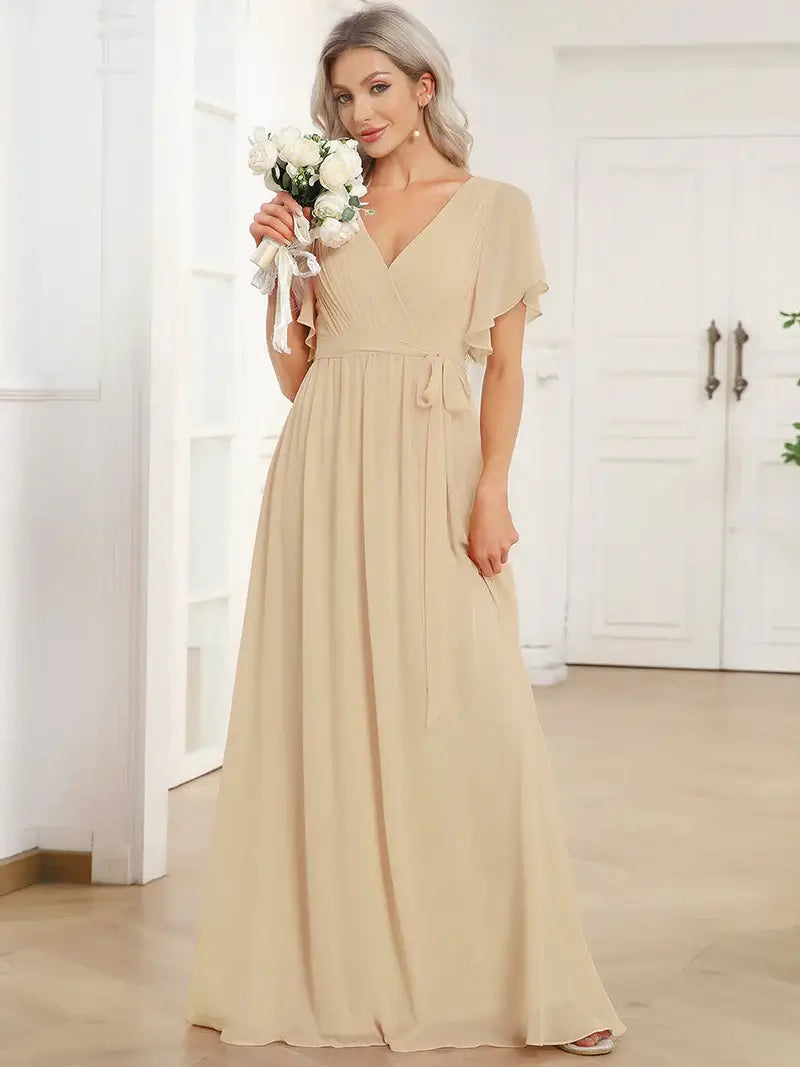 Charcoal elegant A-line bridesmaid dress with deep V-neckline and soft ruffle sleeves