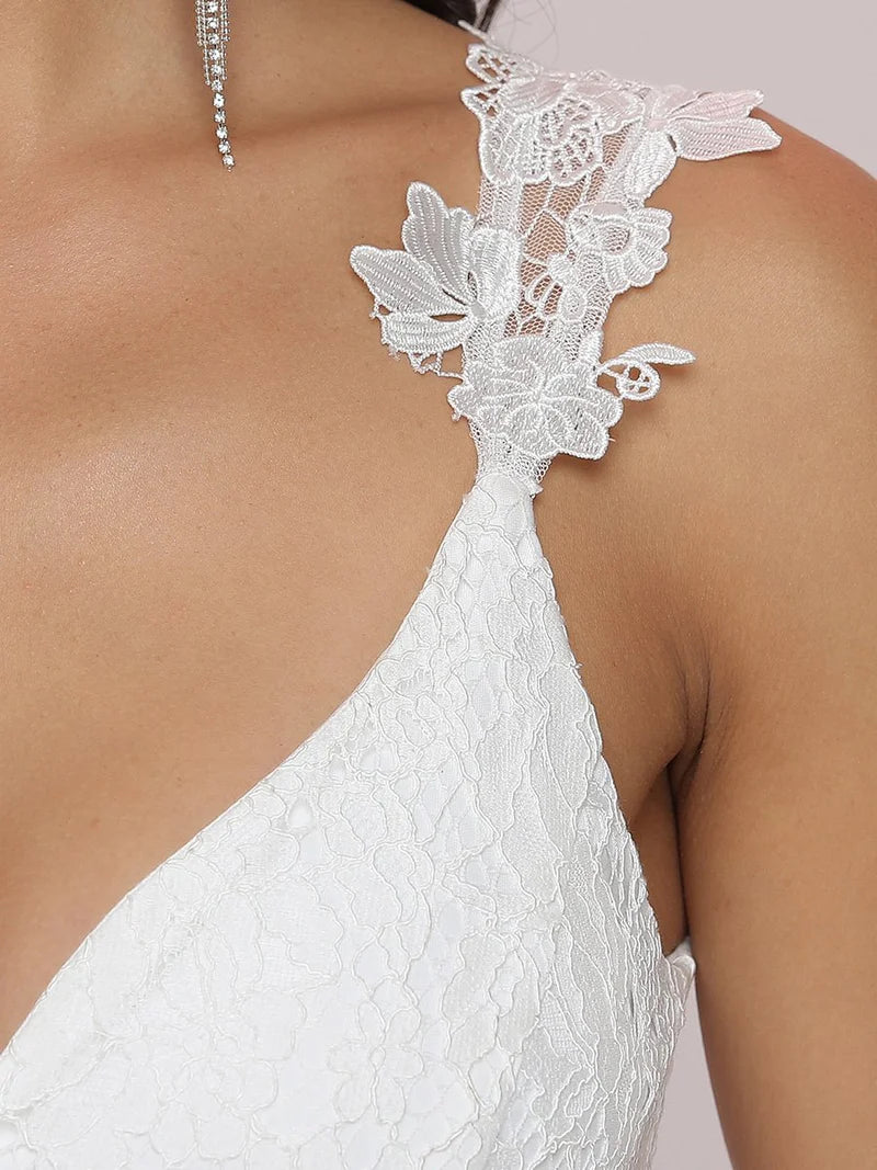 Romantic cream lace tulle wedding dress with double V-neckline and flowing skirt