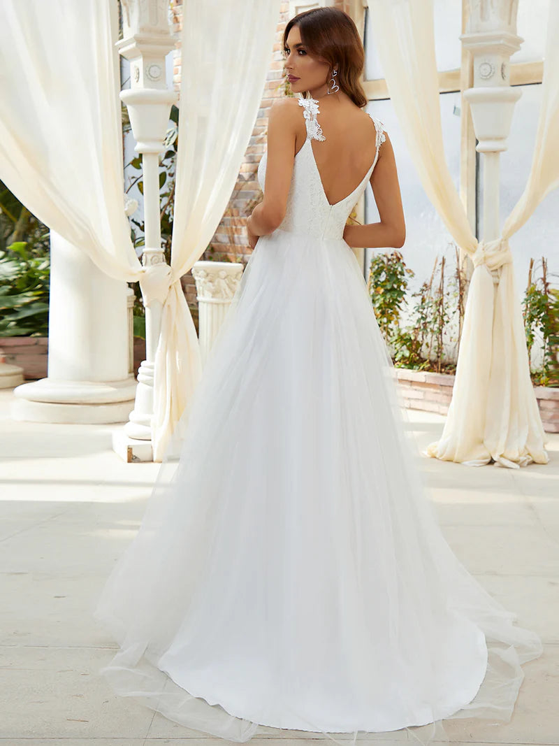 Romantic cream lace tulle wedding dress with double V-neckline and flowing skirt