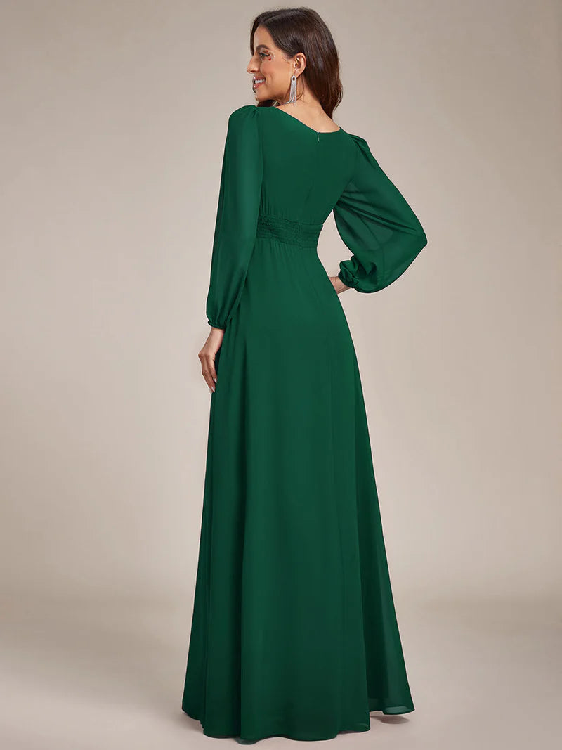 Dark green bridesmaid dress with round neckline and long lantern sleeves