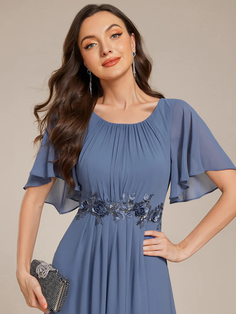 dusty a-line floor-length evening dress with short sleeves, pleated skirt, and applique embellishments