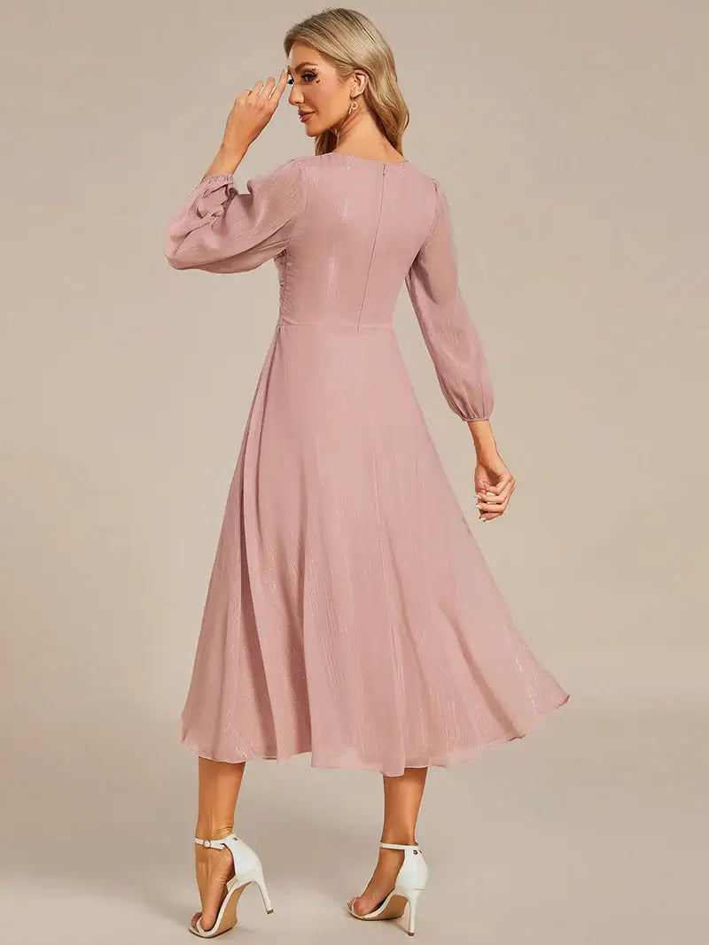 Dusty rose elegant shiny chiffon wedding guest dress with long sleeves and flowing silhouette
