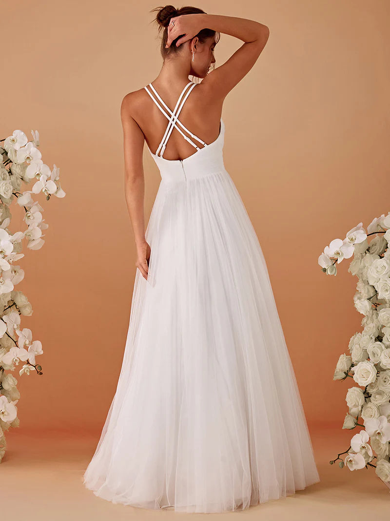 Elegant white mesh wedding dress with V-neckline, floral appliqués, and open back