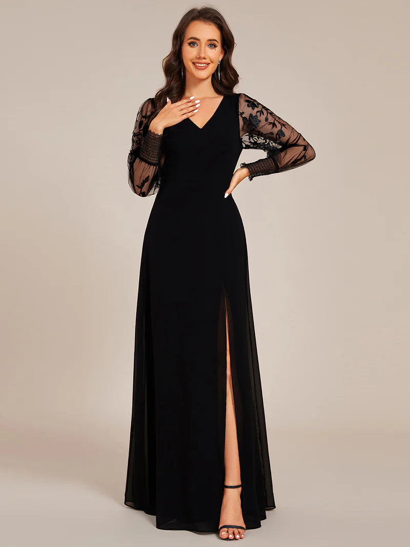 Elegant black chiffon evening dress with embroidery, sheer long sleeves, and side slit hem