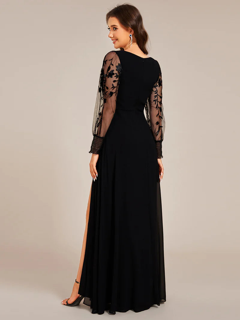 Elegant black chiffon evening dress with embroidery, sheer long sleeves, and side slit hem