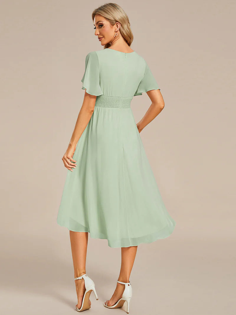 Elegant knee-length A-line wedding guest mint green dress with lotus leaf pleated design