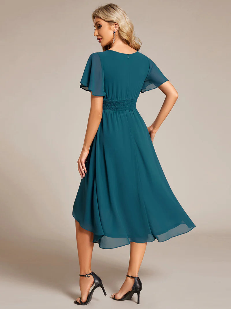 Elegant knee-length A-line wedding guest teal dress with lotus leaf pleated design