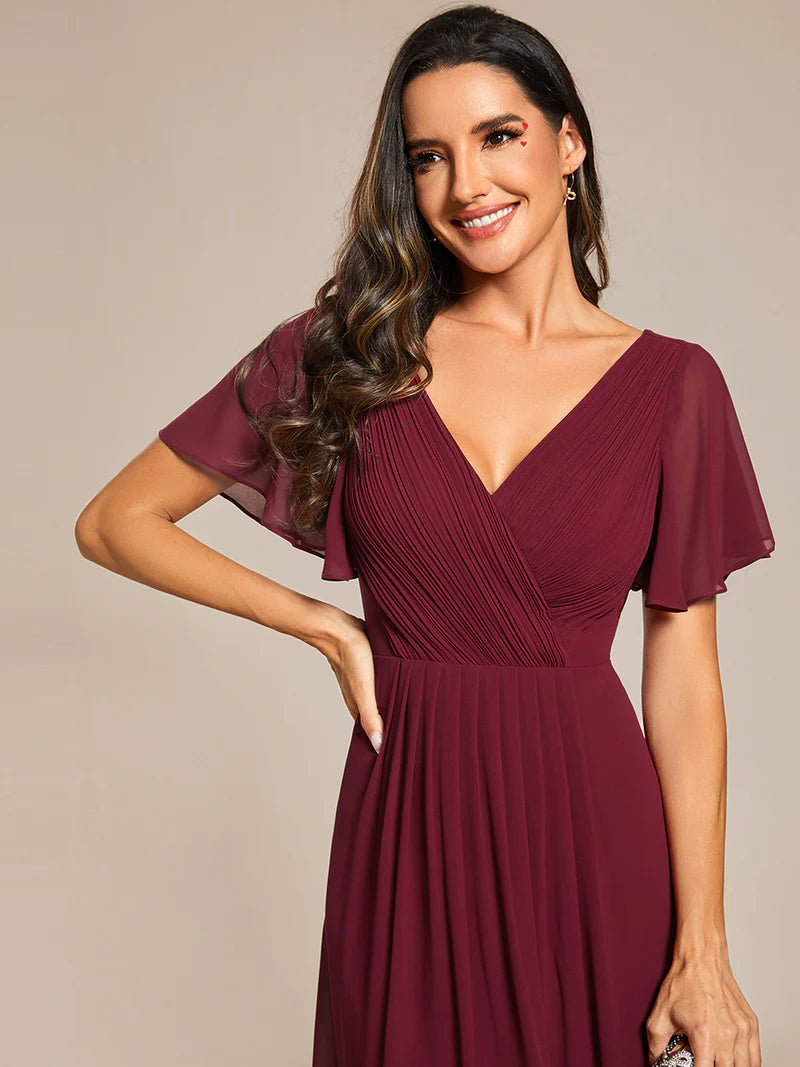 Elegant chiffon wedding guest burgundy dress with pleated skirt and ruffle accents