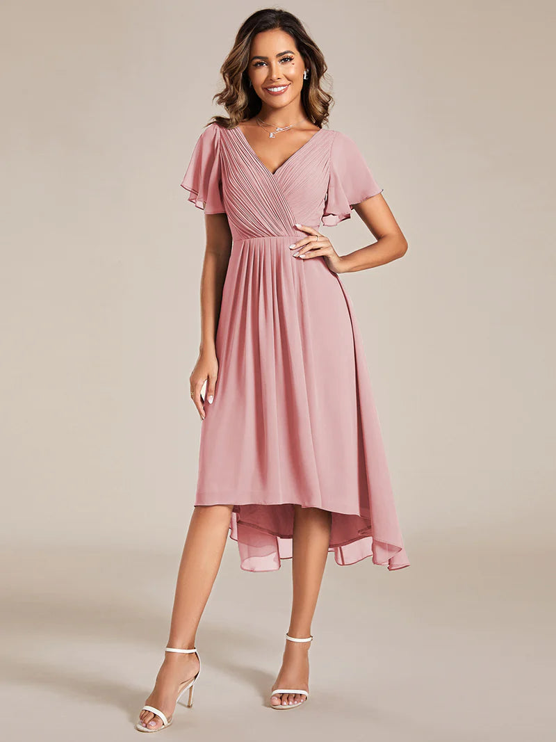 Elegant chiffon wedding guest pink dress with pleated skirt and ruffle accents