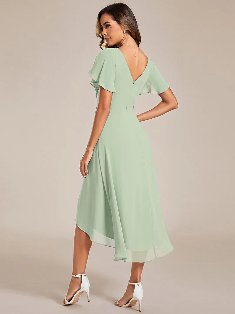 Elegant chiffon wedding guest mint green dress with pleated skirt and ruffle accents