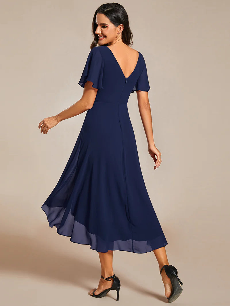 Elegant chiffon wedding guest navy blue dress with pleated skirt and ruffle accents