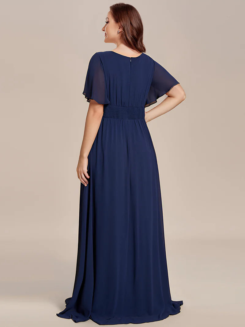 Navy blue elegant round neck bridesmaid dress with pleated skirt and flowy silhouett