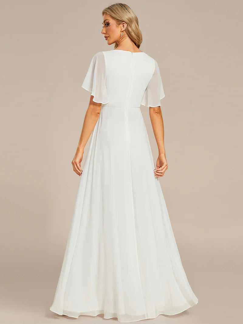 Elegant pleated bridesmaid white dress with V-neckline and floral appliqués