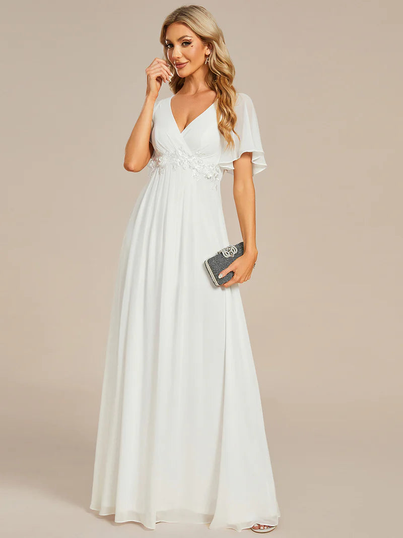 Elegant pleated bridesmaid white dress with V-neckline and floral appliqués