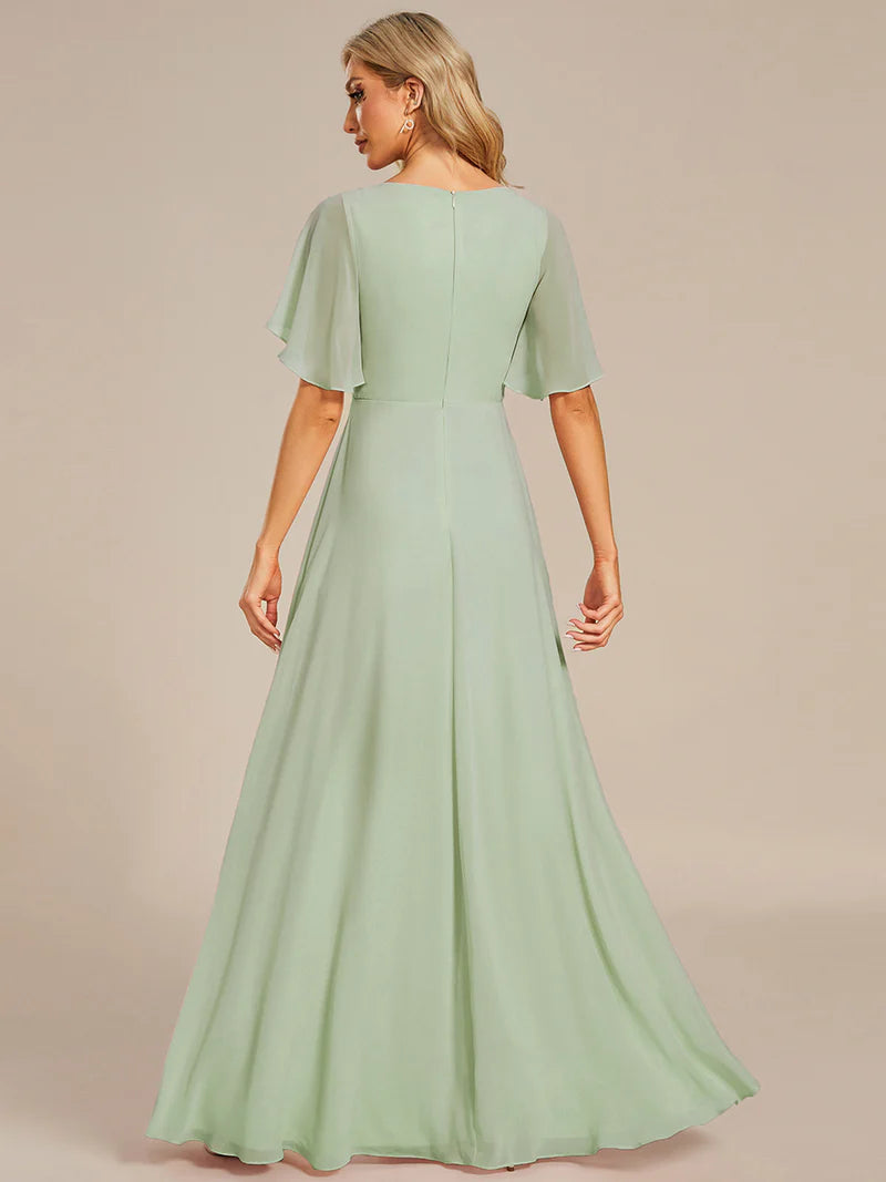 Elegant pleated bridesmaid mint green dress with V-neckline and floral appliqués