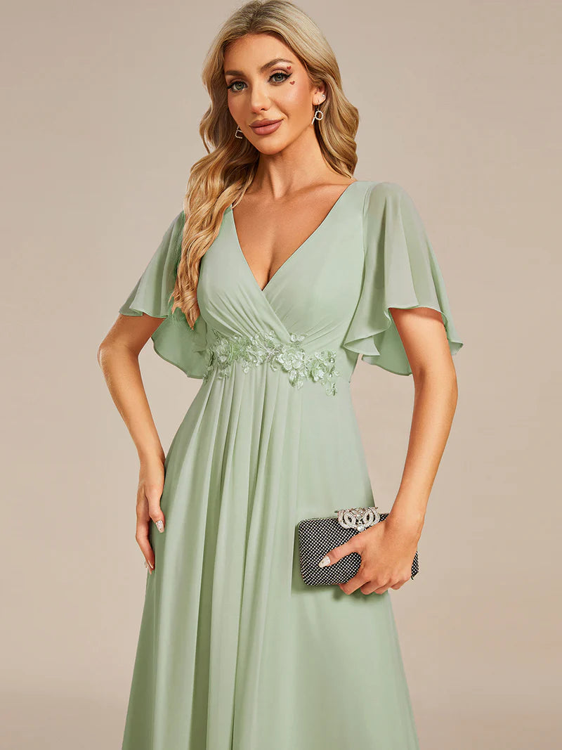 Elegant pleated bridesmaid mint green dress with V-neckline and floral appliqués