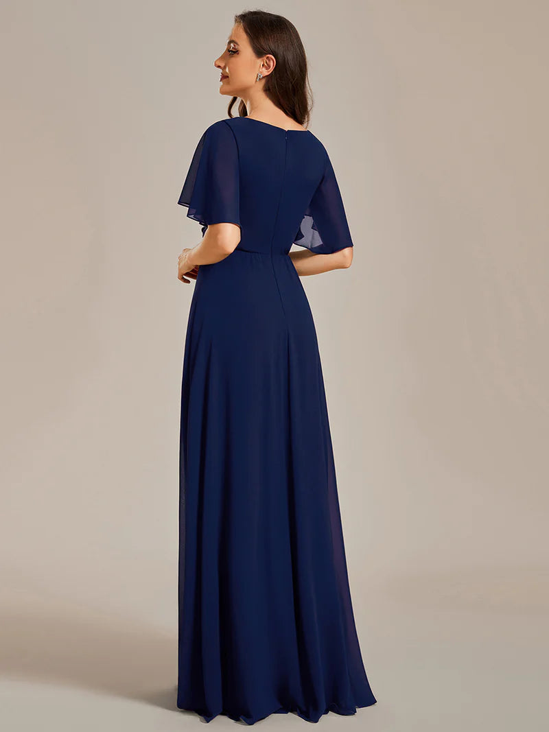 Elegant pleated bridesmaid navy blue dress with V-neckline and floral appliqués