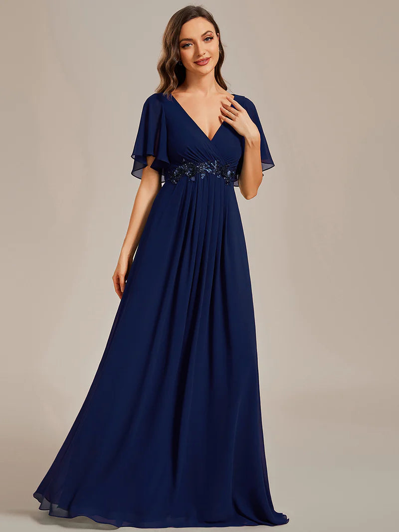 Elegant pleated bridesmaid navy blue dress with V-neckline and floral appliqués