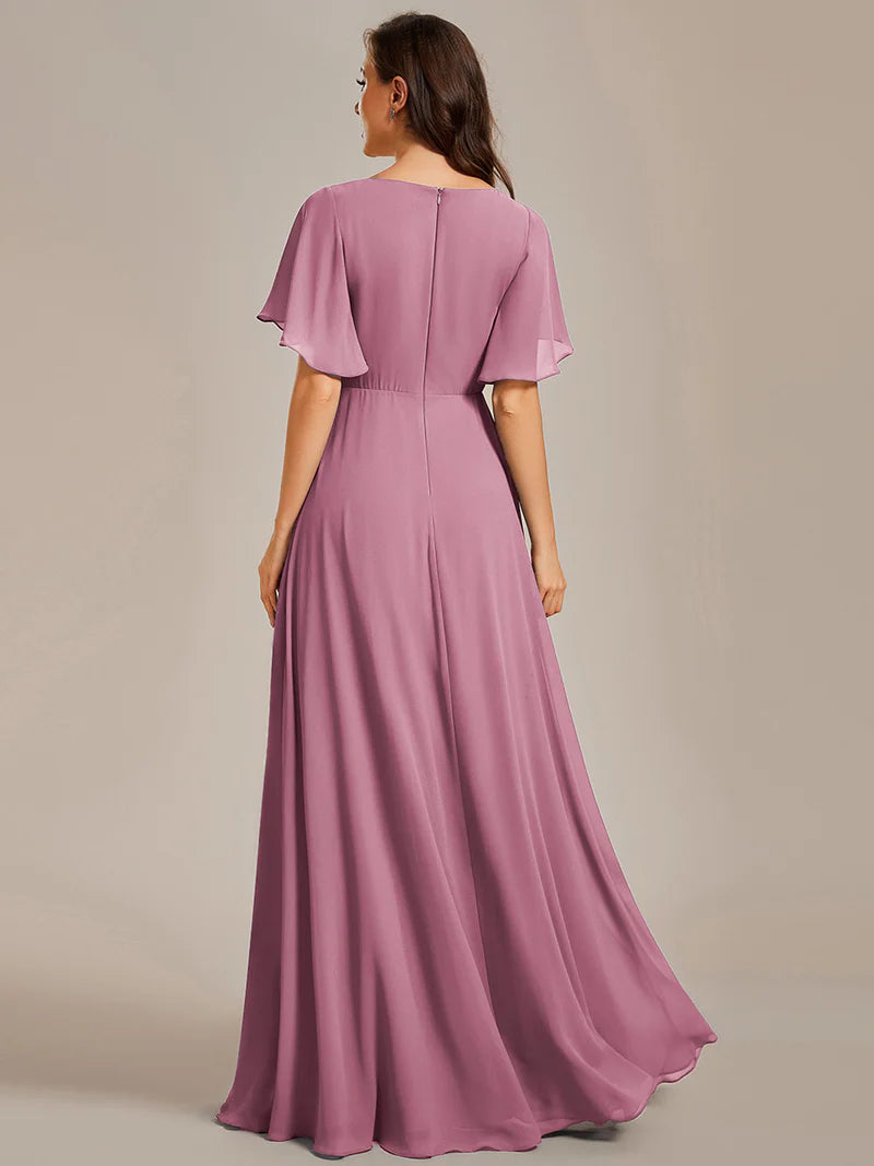 Elegant pleated bridesmaid orhidea dress with V-neckline and floral appliqués