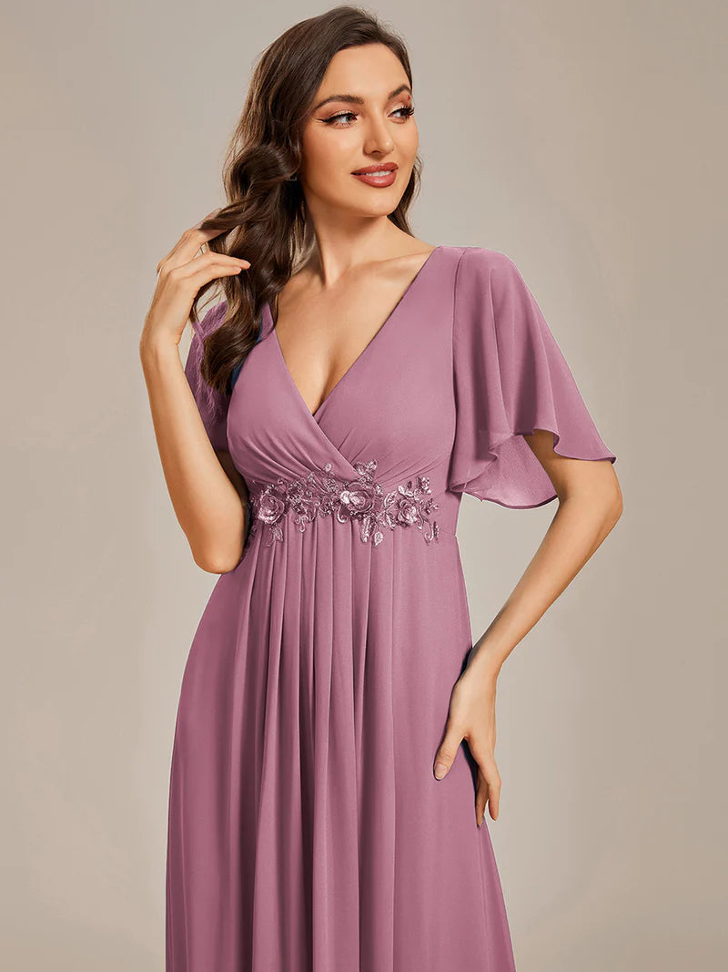 Elegant pleated bridesmaid orhidea dress with V-neckline and floral appliqués