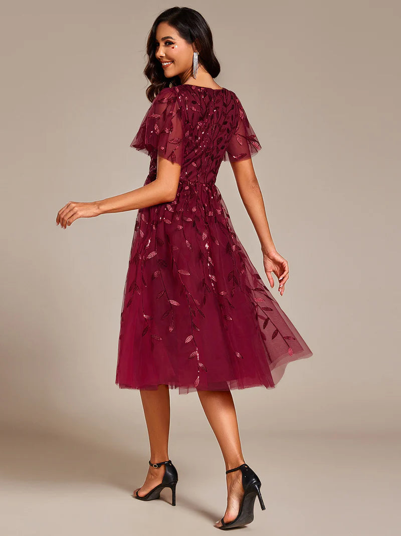 Exquisite midi length Burgundy dress with ruffled sleeves, tulle fabric, sequin details, and embroidery