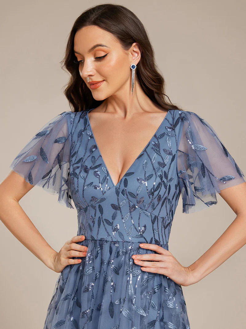 Exquisite midi length Dusty Blue dress with ruffled sleeves, tulle fabric, sequin details, and embroidery