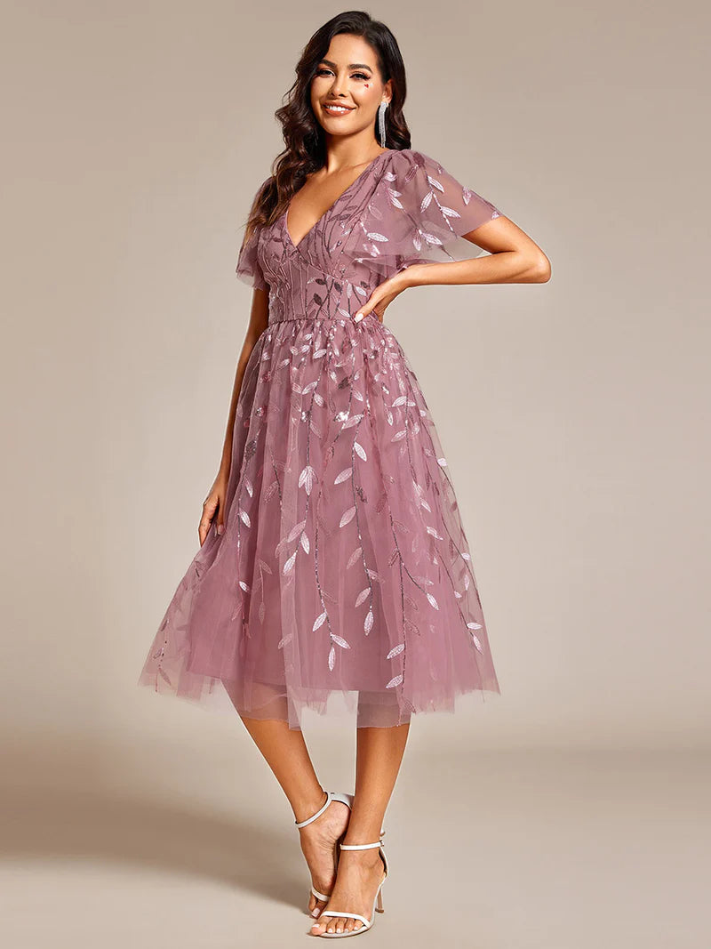 Exquisite midi length Orhidea dress with ruffled sleeves, tulle fabric, sequin details, and embroidery