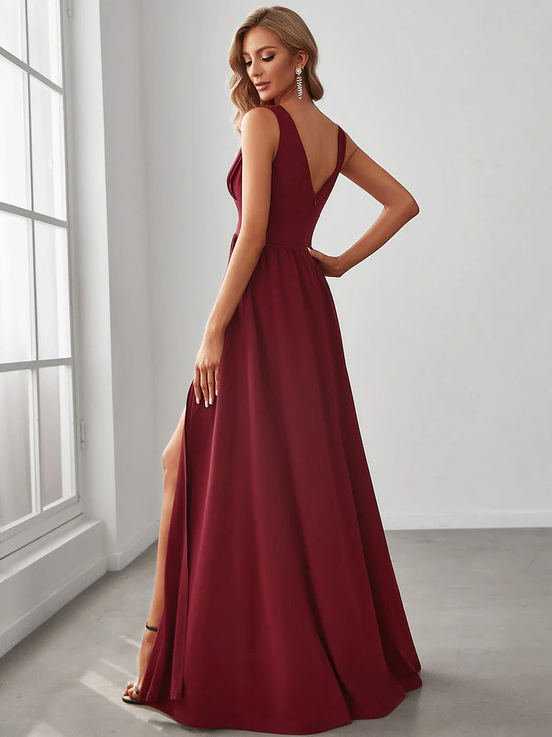 Elegant floor-length evening burgundy dress with V-neck, empire waist, and high slit