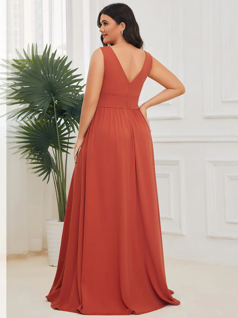 Elegant floor-length evening burnt orange dress with V-neck, empire waist, and high slit