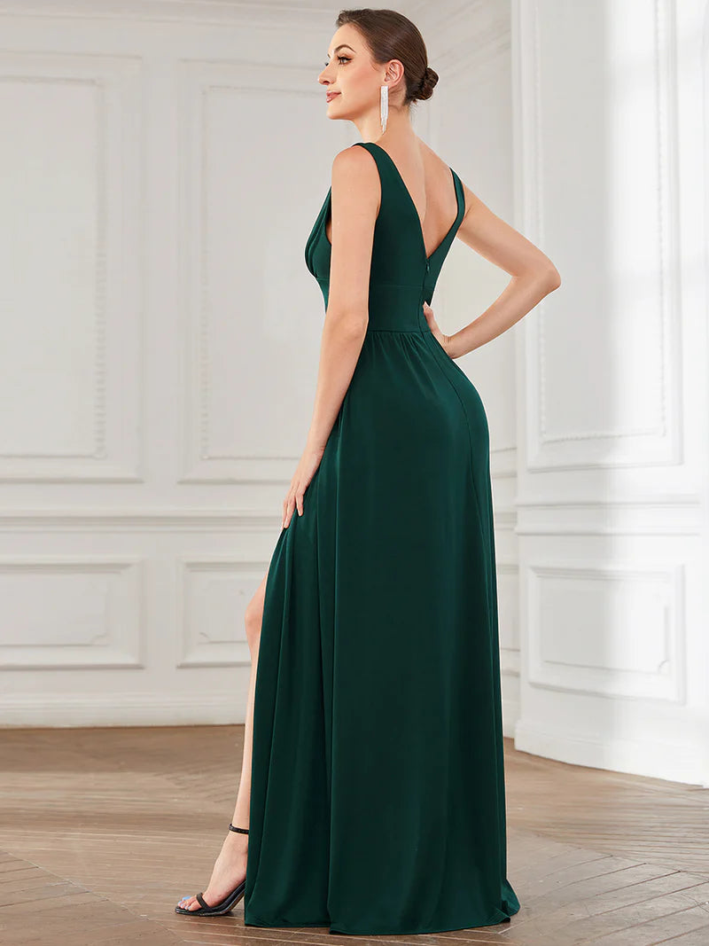 Elegant floor-length evening dark green dress with V-neck, empire waist, and high slit