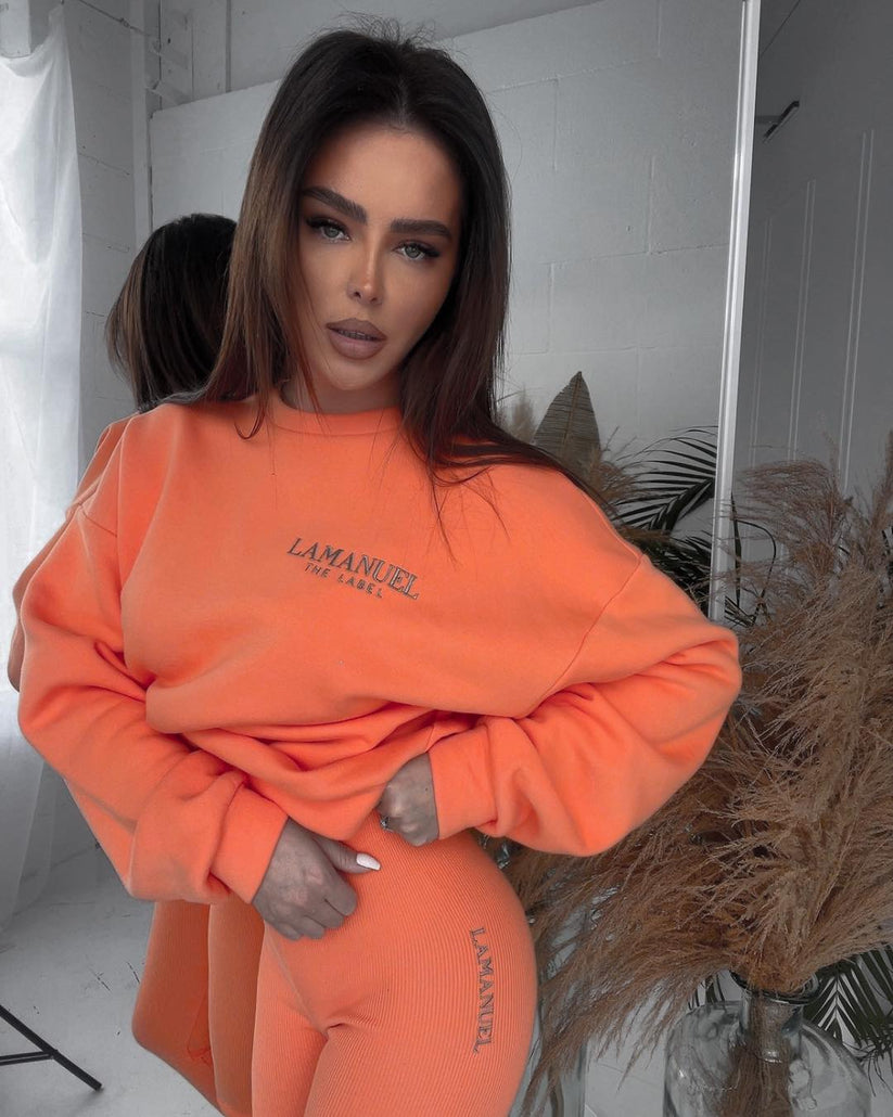 Issamatch orange tracksuit, vibrant two-piece set perfect for sporty style