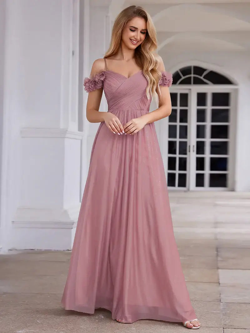 Glamorous sequin gown featuring off-the-shoulder sleeves, sweetheart bodice, and floral accents orhid dress
