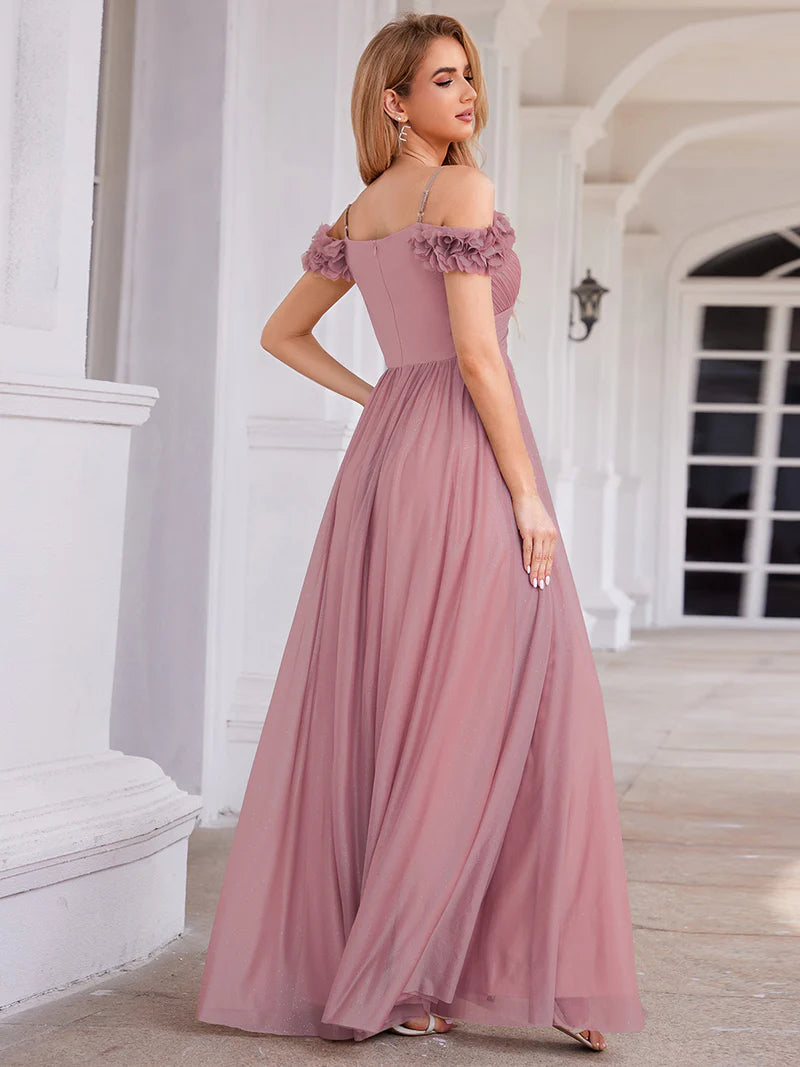 Glamorous sequin gown featuring off-the-shoulder sleeves, sweetheart bodice, and floral accents orhid dress