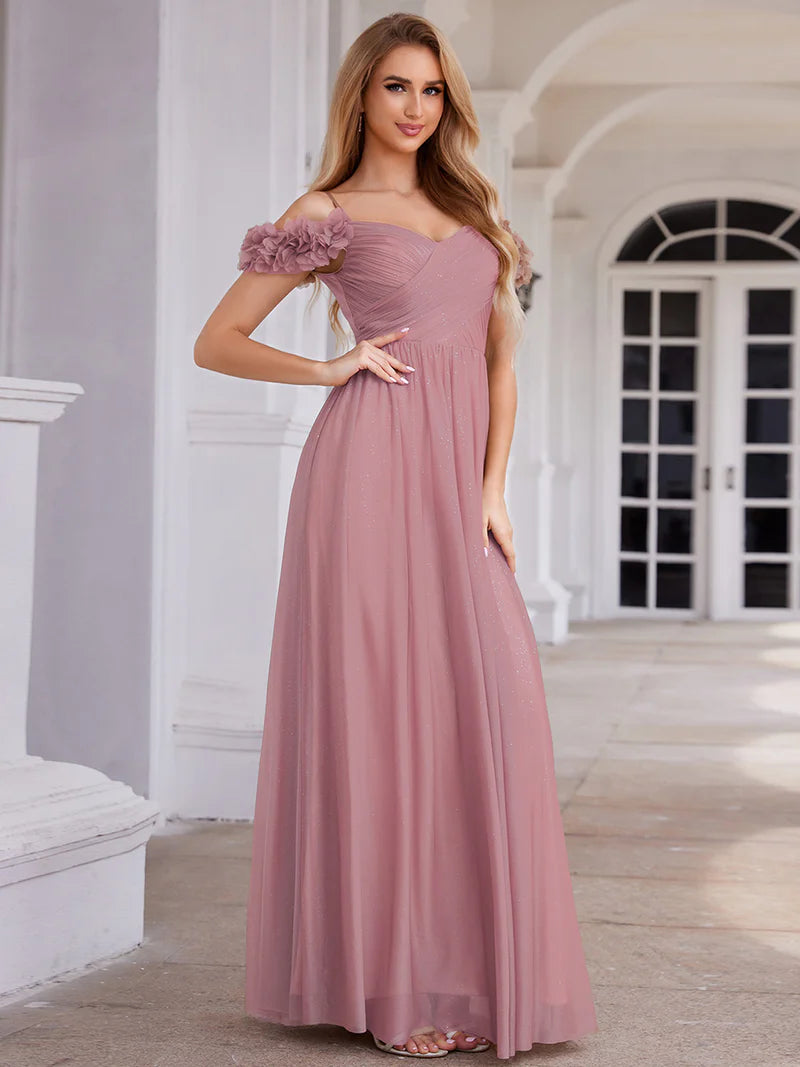 Glamorous sequin gown featuring off-the-shoulder sleeves, sweetheart bodice, and floral accents orhid dress