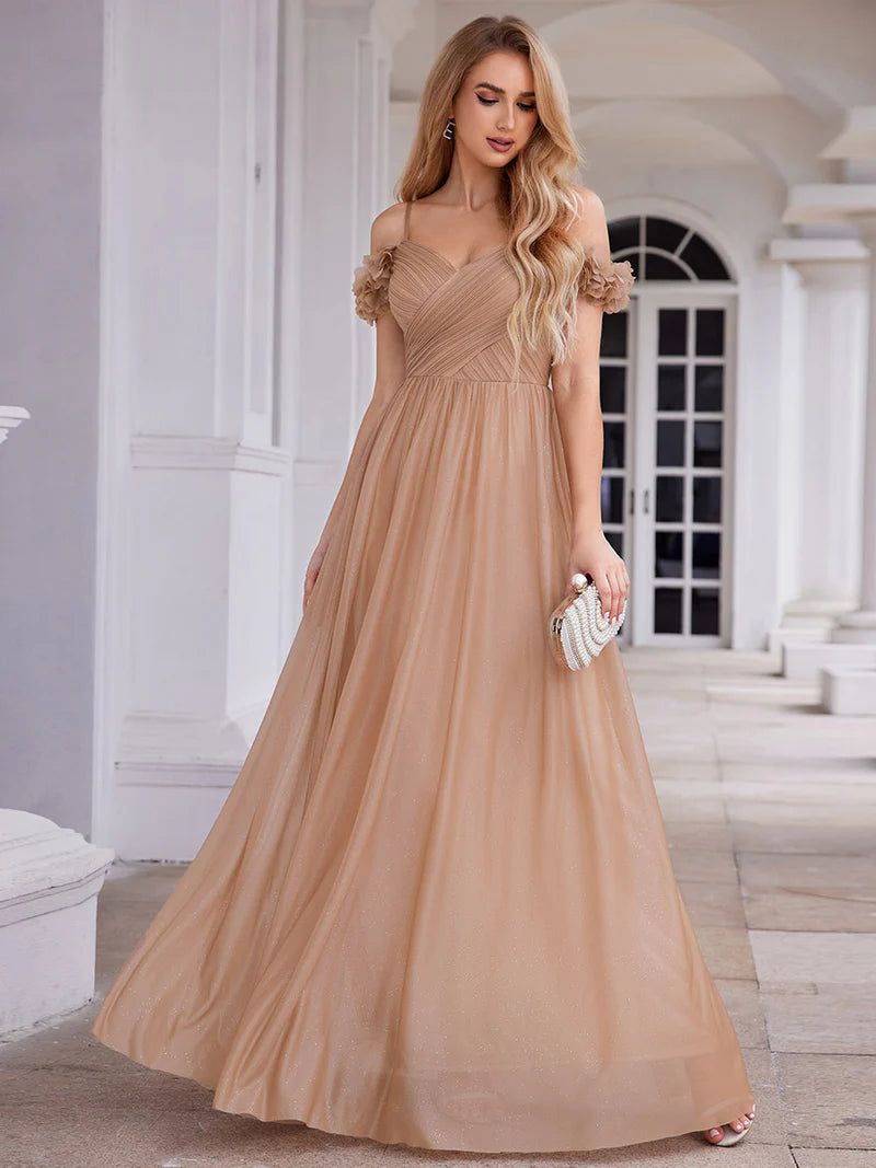 Glamorous sequin gown featuring off-the-shoulder sleeves, sweetheart bodice, and floral accents rose gold dress