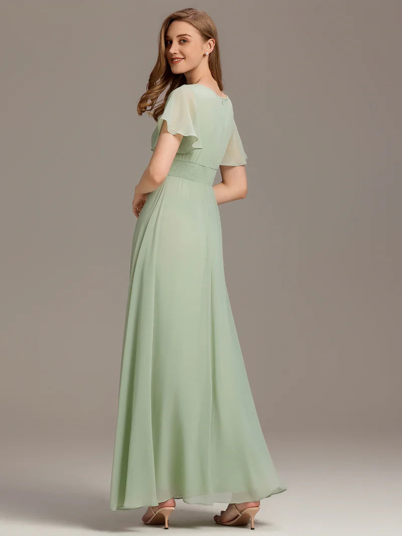 Round neck mint green bridesmaid gown in a pleated design for elegant wedding looks