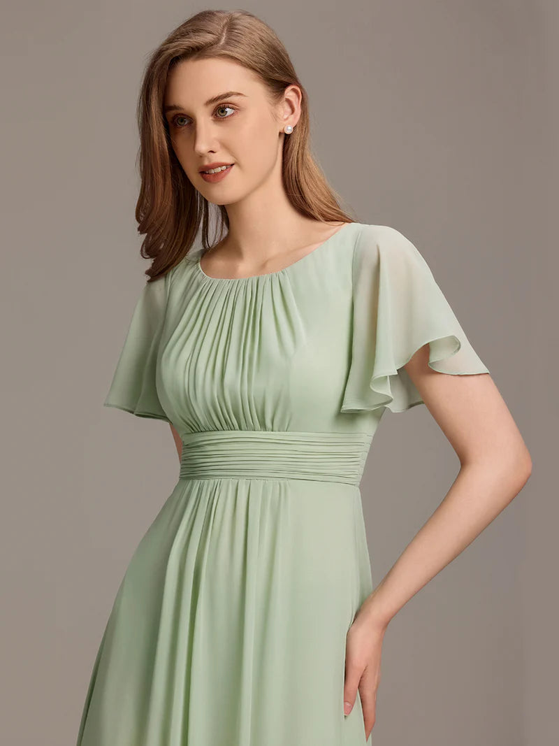 Round neck mint green bridesmaid gown in a pleated design for elegant wedding looks