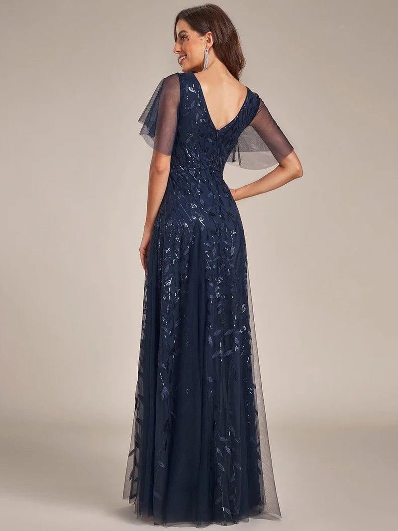 Navy blue romantic shimmery evening gown with V-neckline, ruffle sleeves, and maxi length